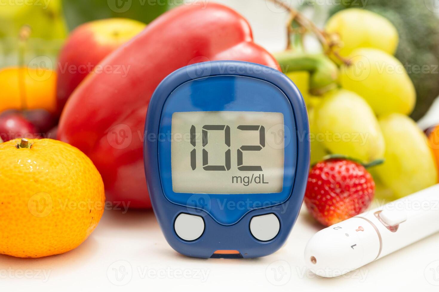 digital glucose monitor measure with vegetable and fruit food. photo