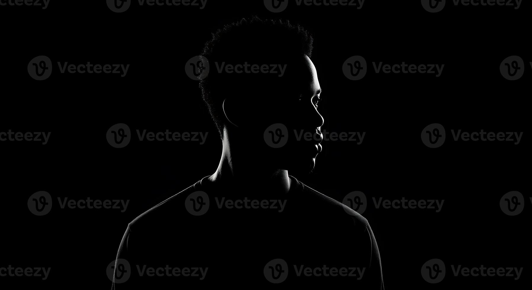 A silhouette of a man in the dark photo
