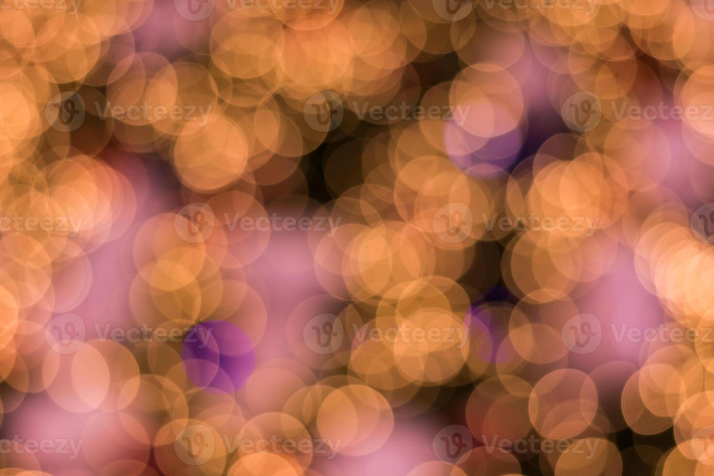 A blurry image of a purple and gold background photo
