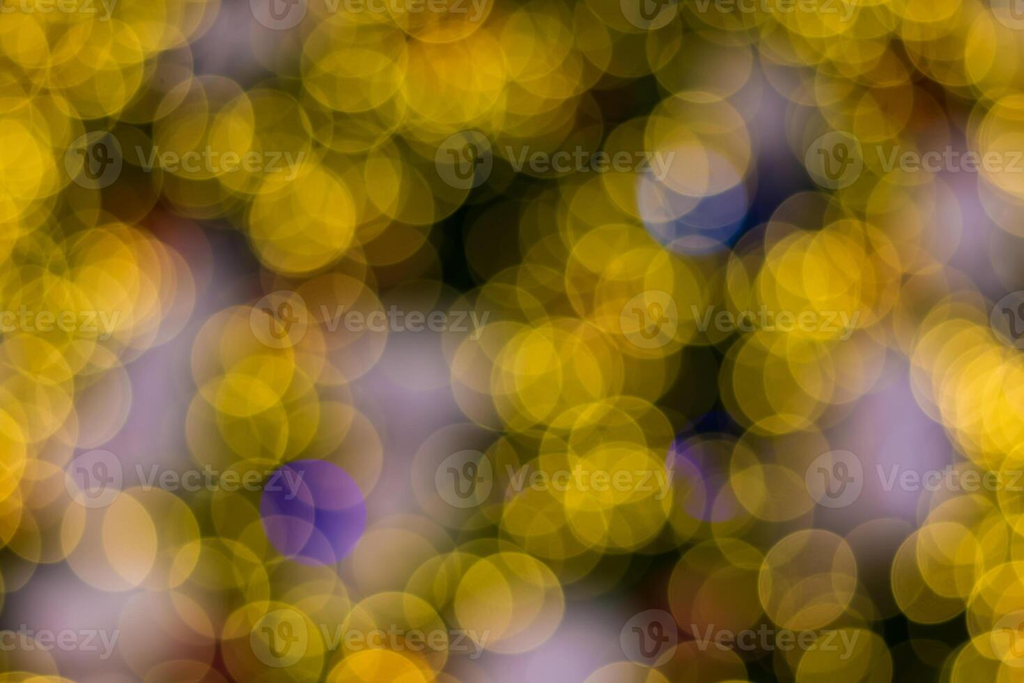 A blurry image of a yellow and purple christmas tree photo