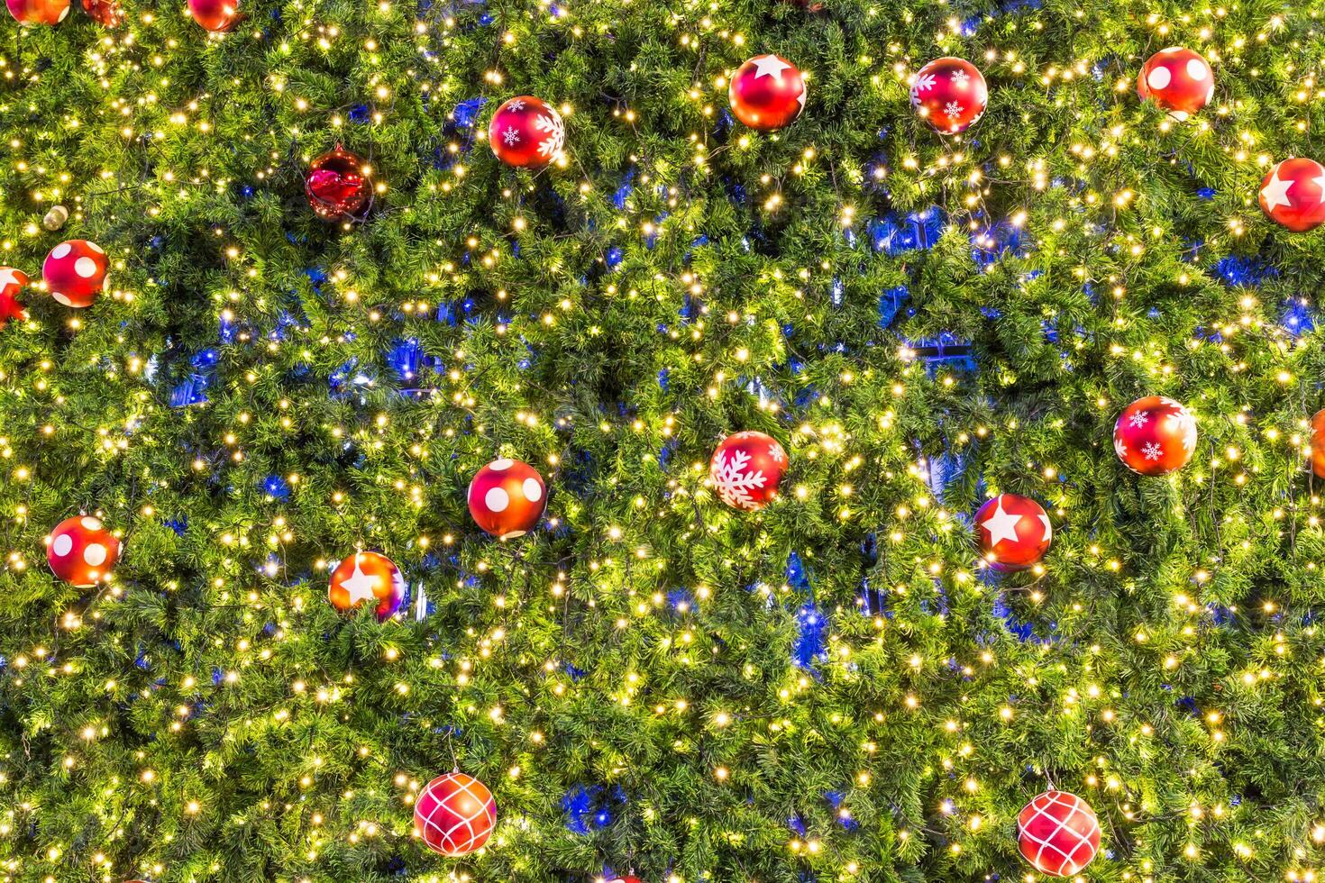 A christmas tree with many ornaments on it photo