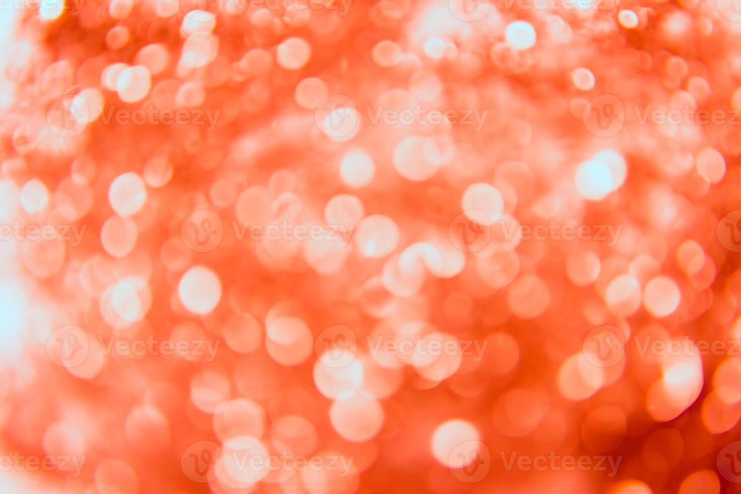 Red and white bokeh background with a red and white christmas tree photo