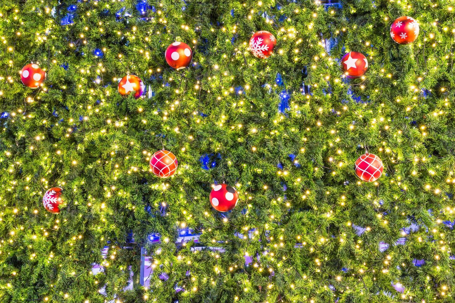 A large christmas tree with many ornaments on it photo