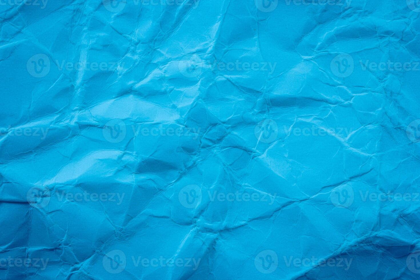 Crumpled blue paper background photo