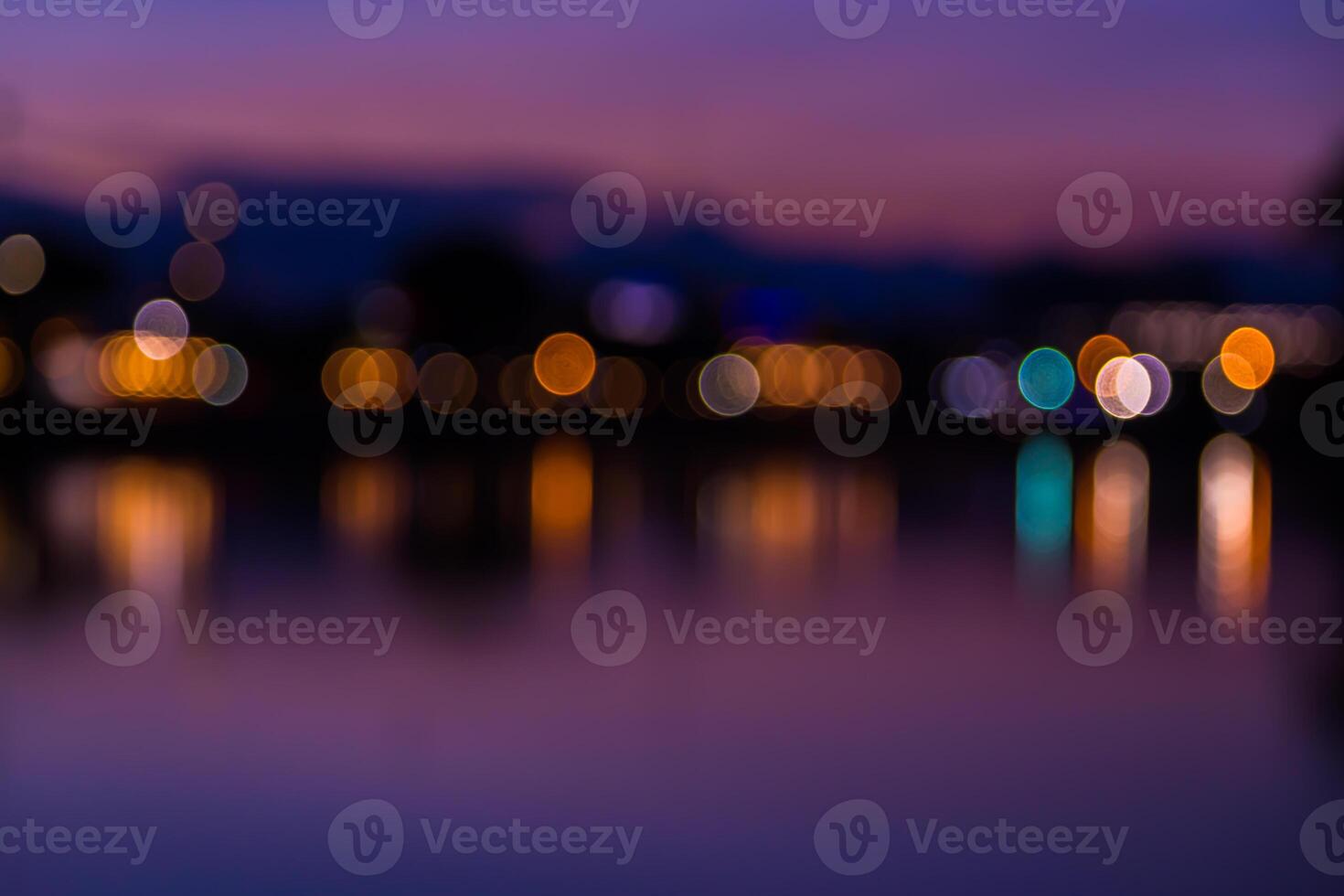 A blurry photo of a city at night with lights