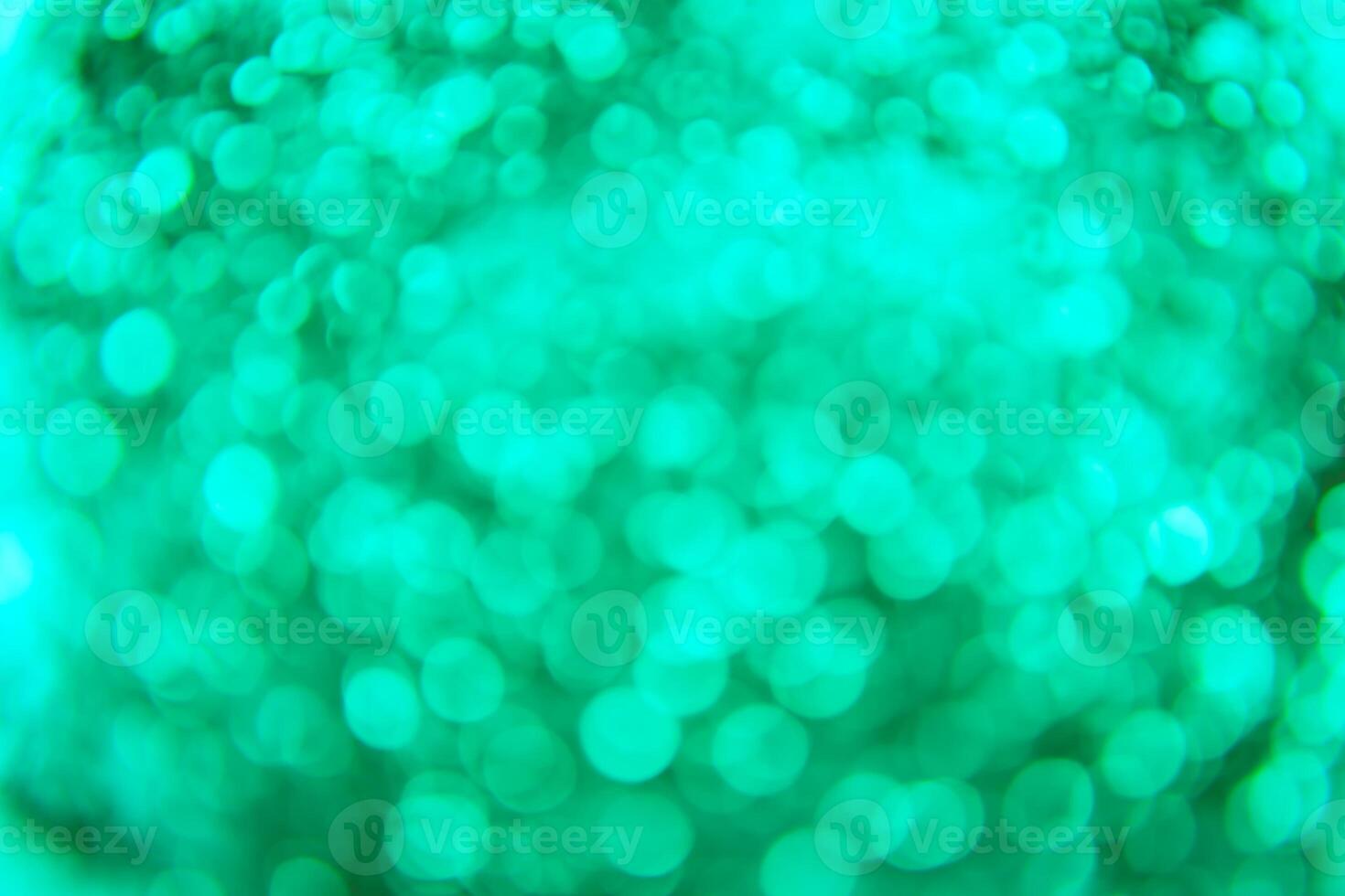 A green and white background with a blurry image of bubbles photo