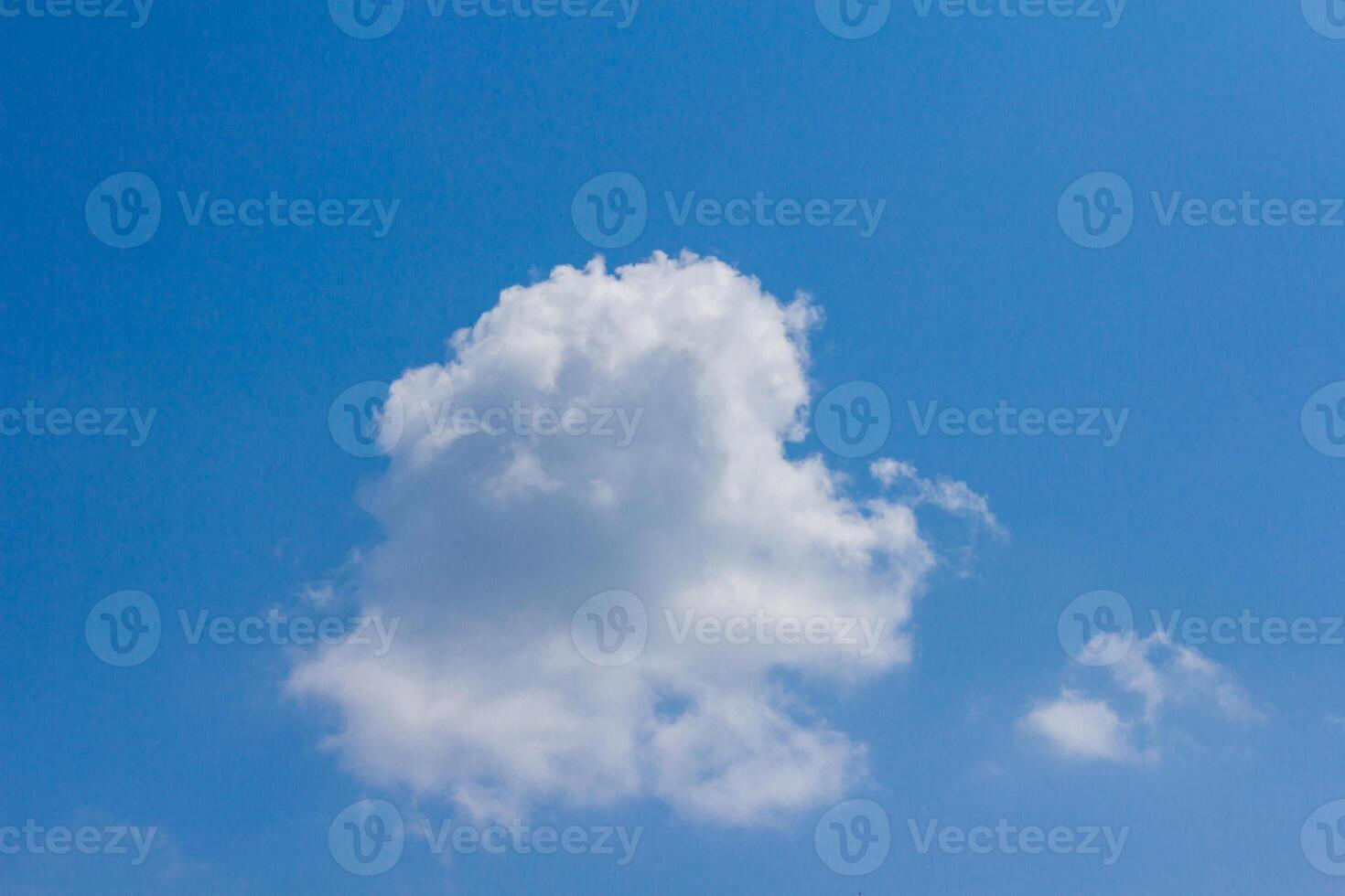 A large white cloud in the blue sky photo