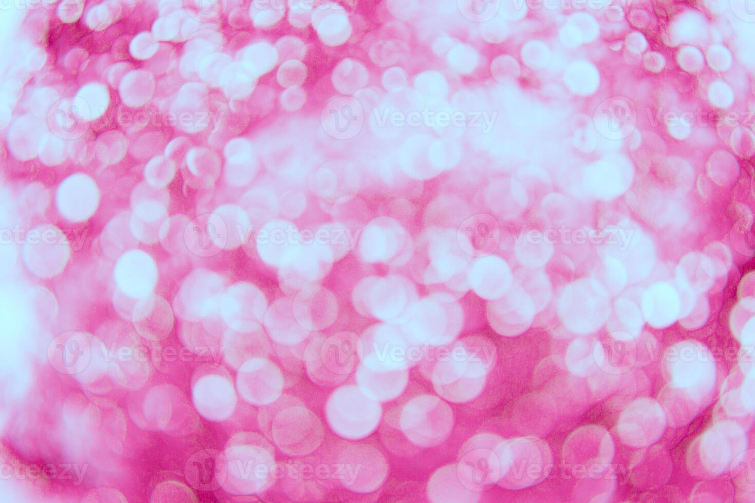 A pink and white background with a lot of white circles photo