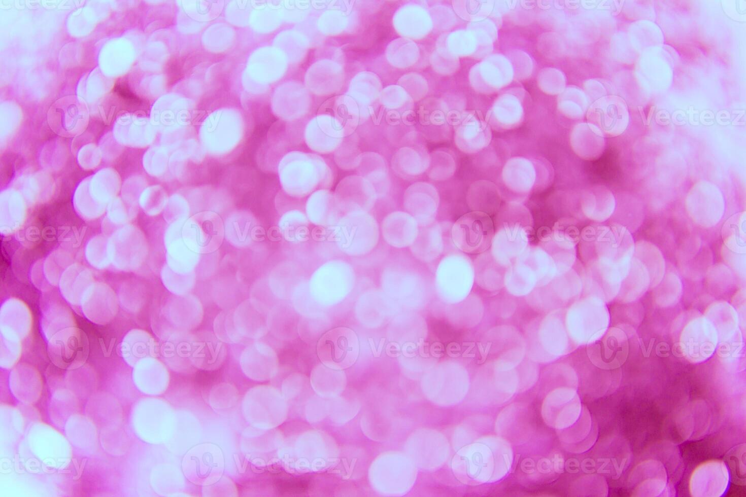 A pink background with many small circles photo