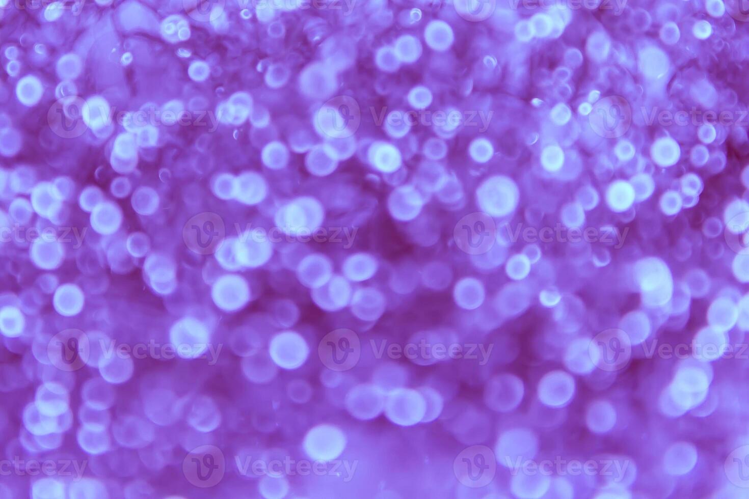 A purple background with many small bubbles photo