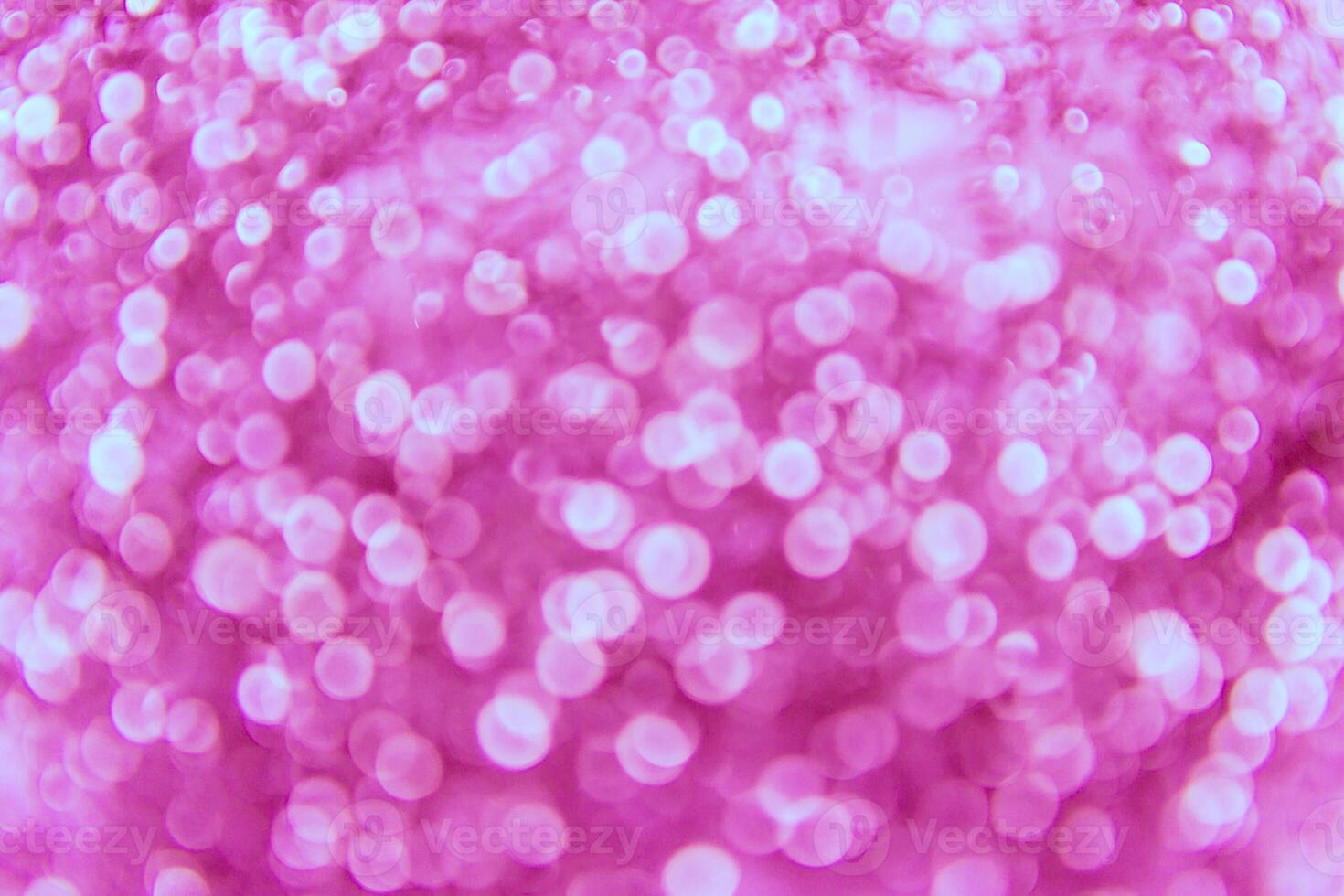 A pink background with many bubbles and bubbles photo