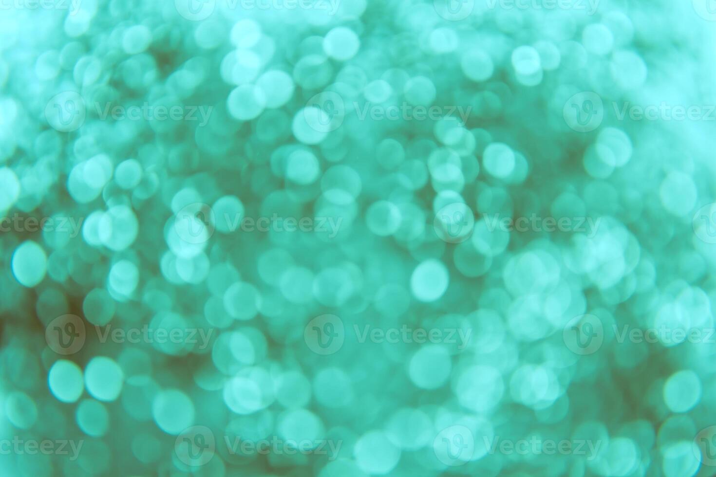 A blurry image of a green background with circles photo