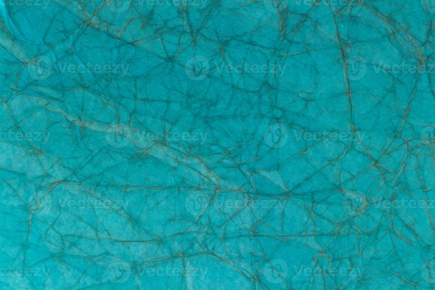 A close up of a blue and green fabric photo