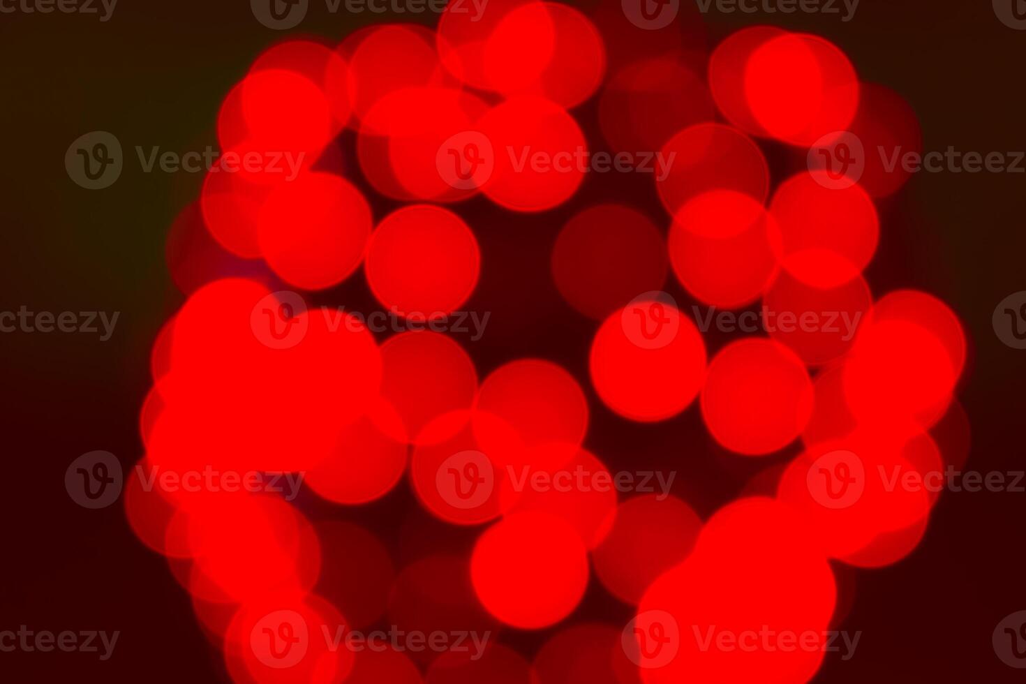 A red light is shown in the dark photo