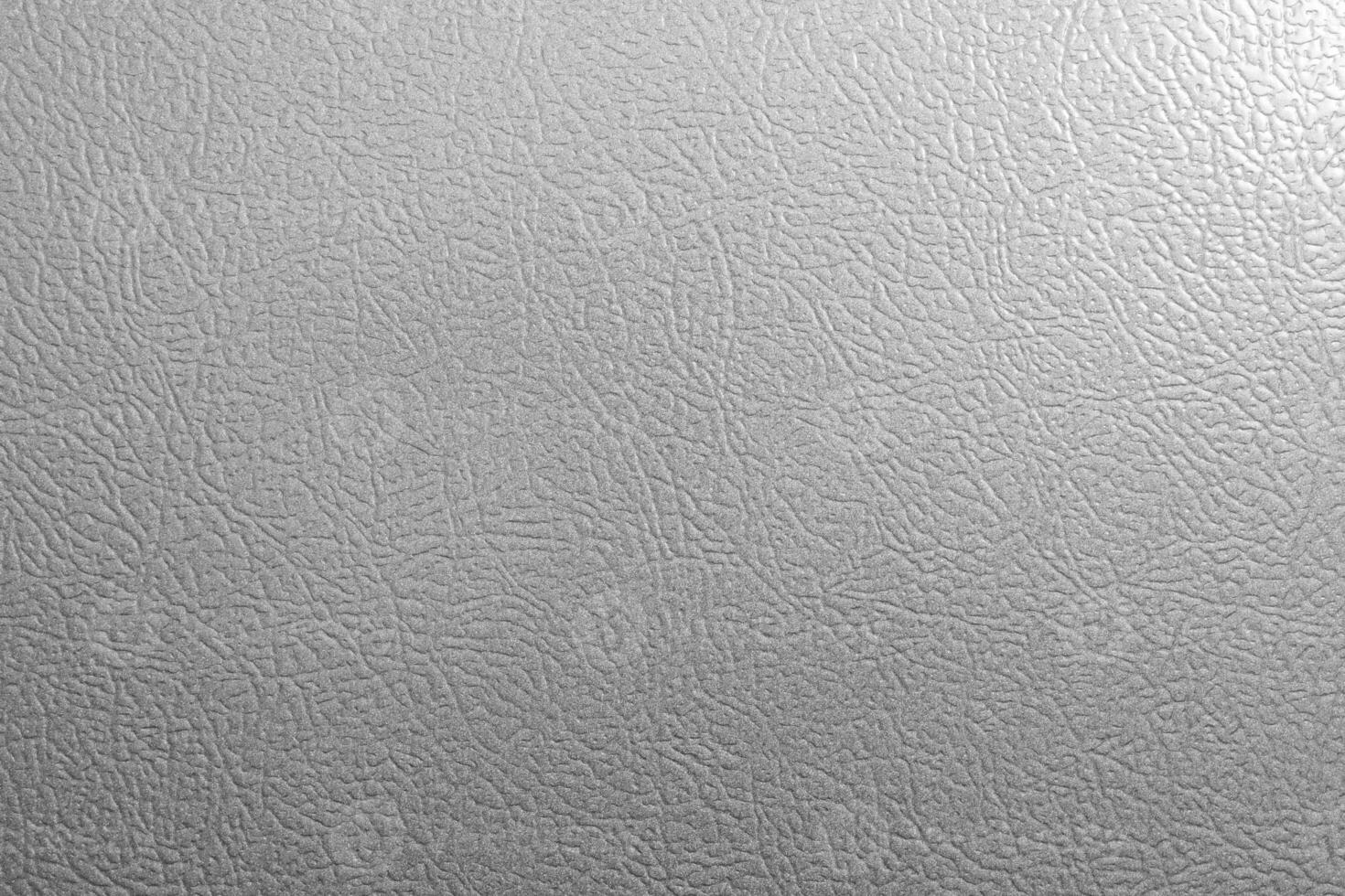 A white leather surface with a pattern photo
