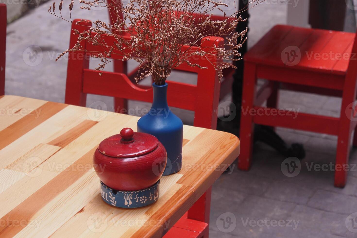 Colorful dining table with decorations in an outdoor setting photo