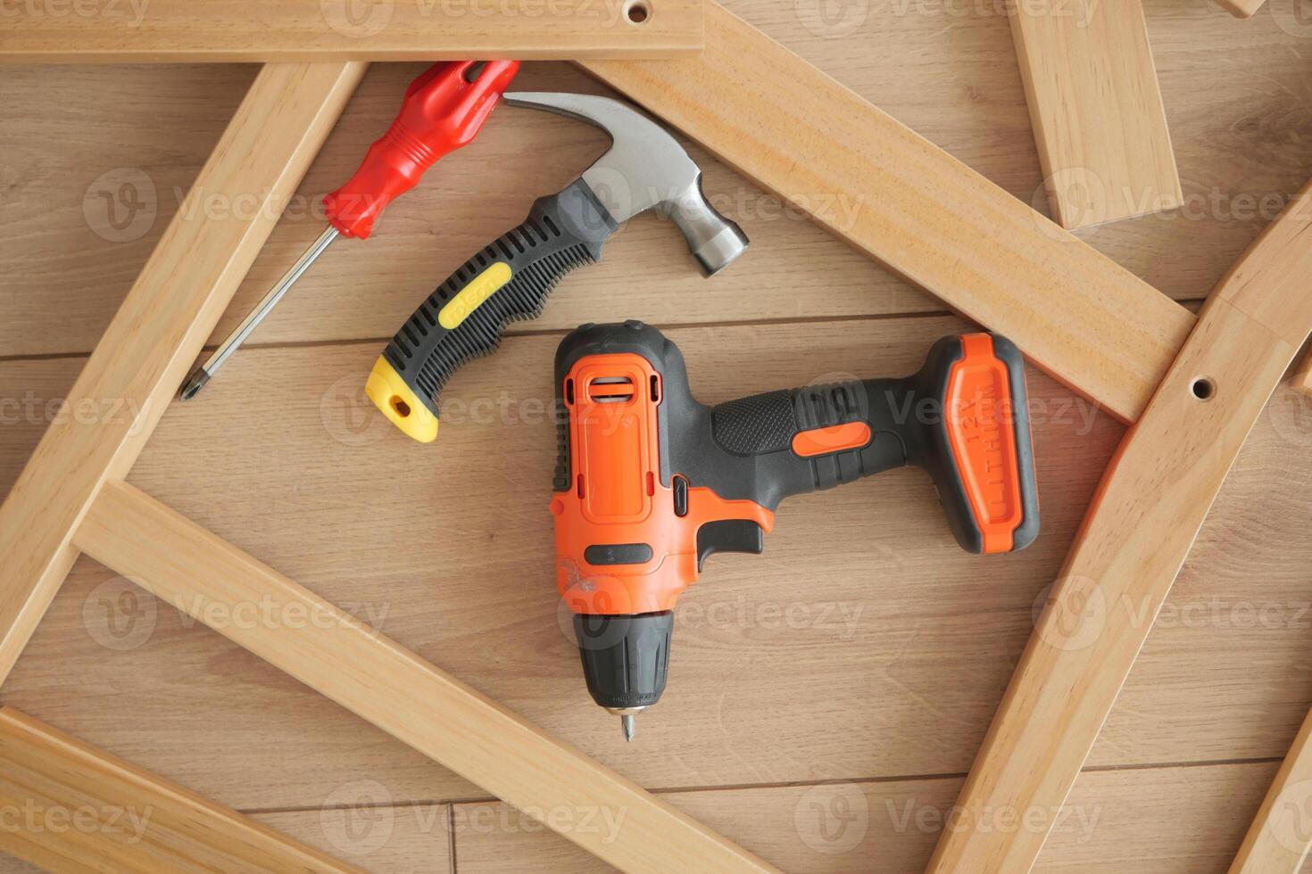 Tools arranged on wooden surface for home projects photo