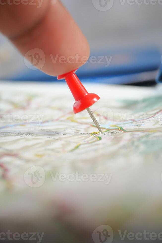 Marking a destination on a map with a red pin photo