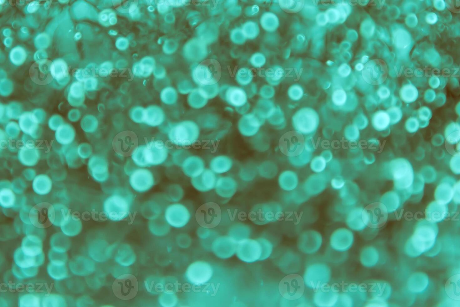 A green background with many bubbles photo