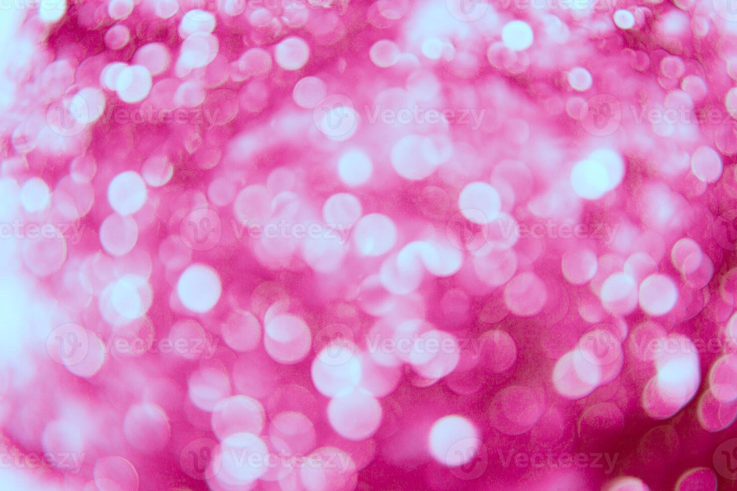 A pink background with a lot of white lights photo