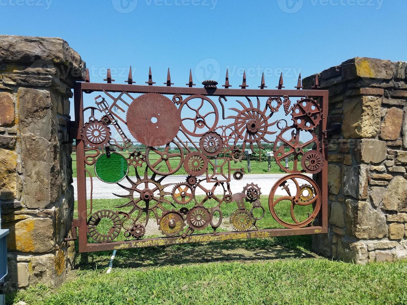 Rusty Steampunk Style Gate of Gears and Wheels in Carthage, Missouri, Route 66 photo
