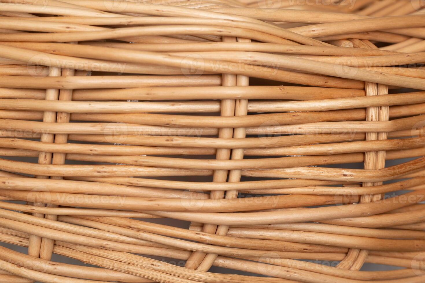 Close-up of Woven Natural Wicker Basket Displaying Intricate Patterns and Textures photo