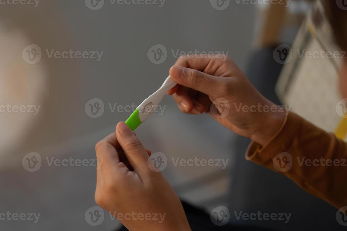 Pregnancy Test. Woman examining results with focus. photo