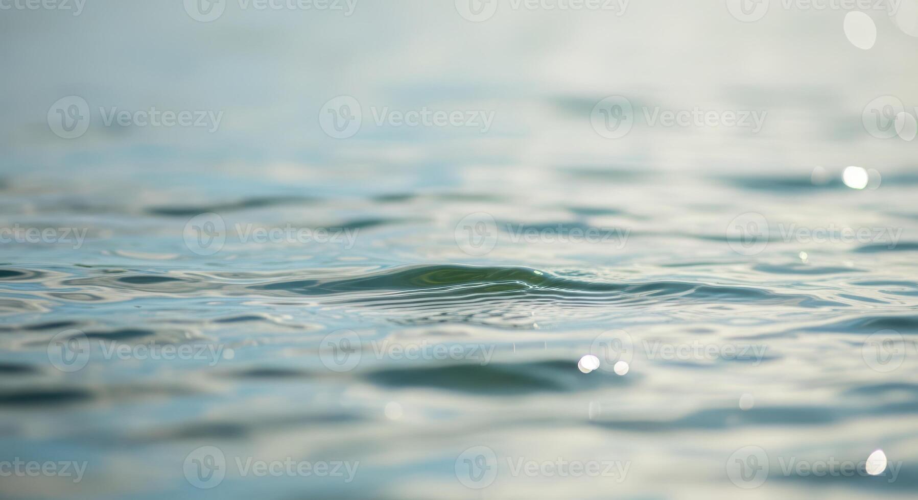 Water surface with waves and sunlight on it photo