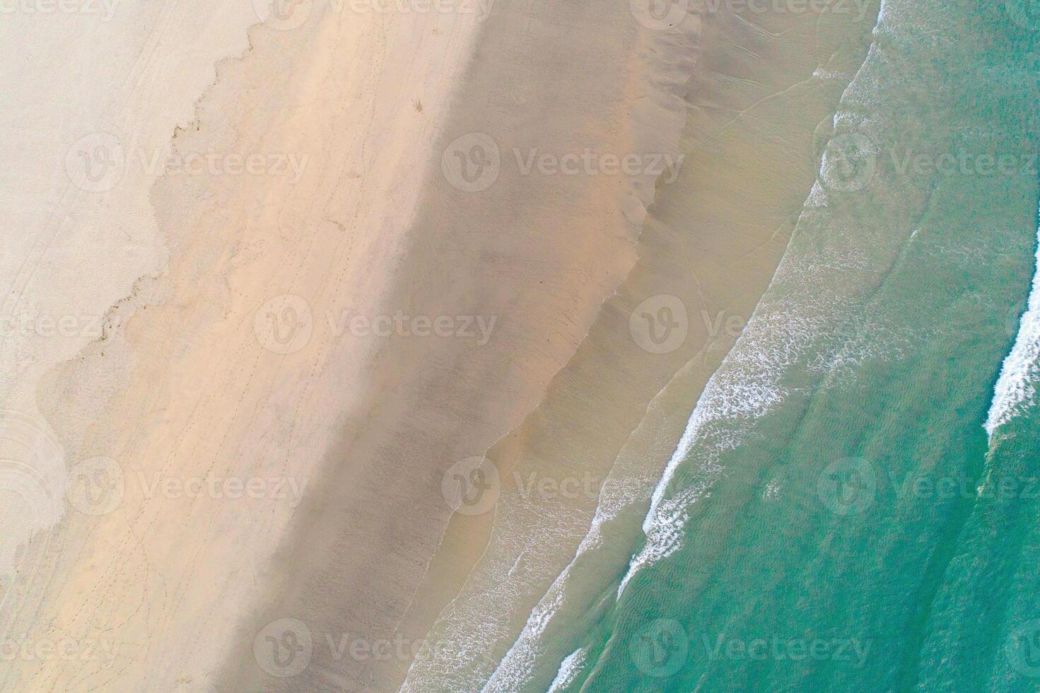Top Down View of a Tropical Beach with Turquoise Water, aerial drone top down view zenithal photo