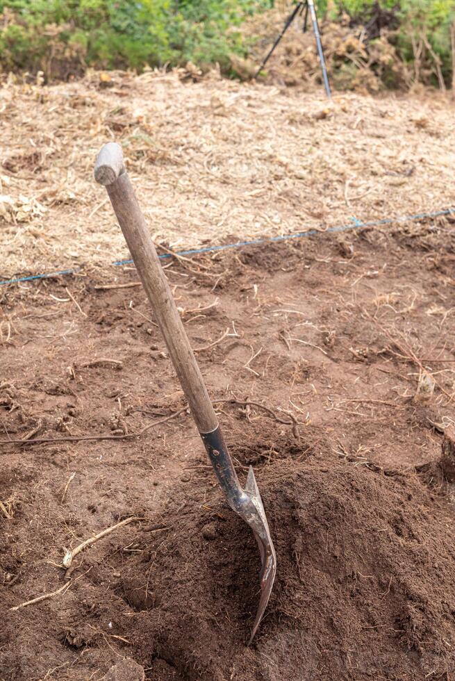 Construction Site with a Shovel in a Mound of Dirt photo