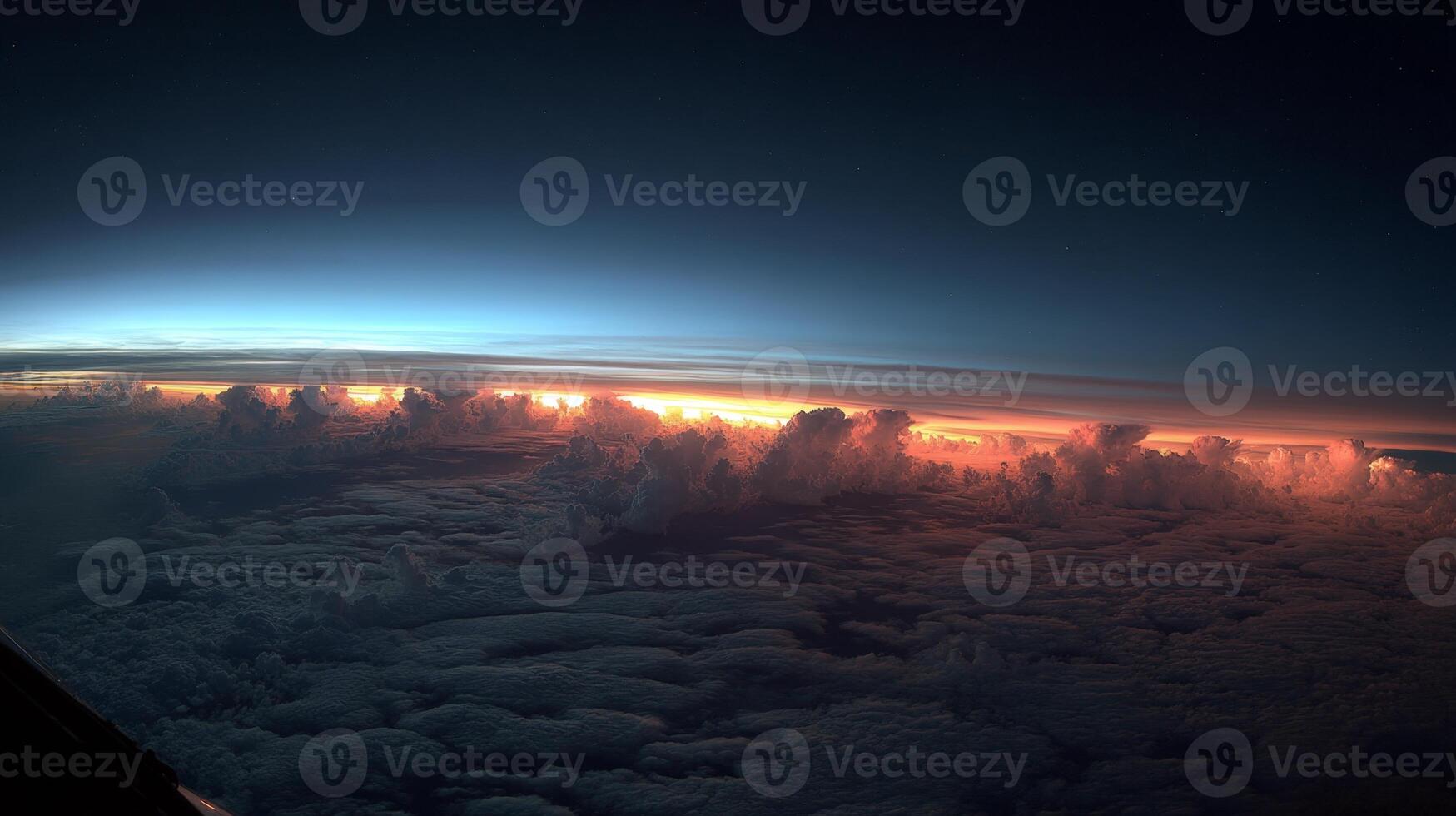 Breathtaking View of Cloud Edges Illuminated by Sunset Above the Earth's Atmosphere photo