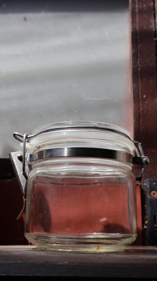 Glass jars placed in a vintage-style kitchen photo