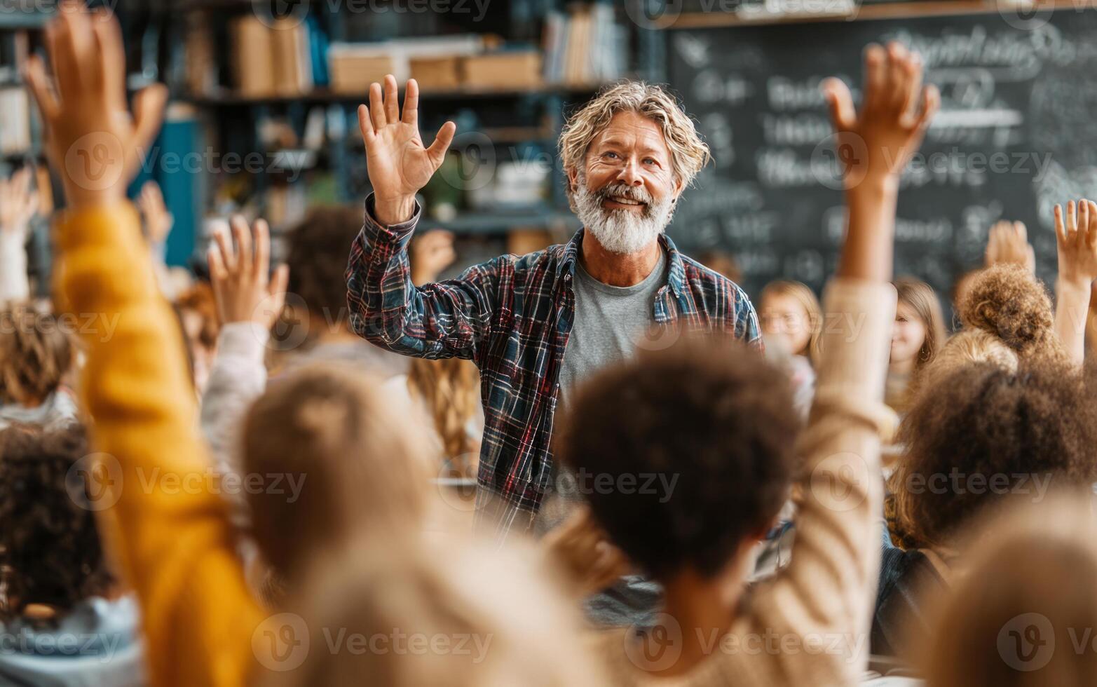 Smiling teacher waving to elementary school students raising hands in classroom photo
