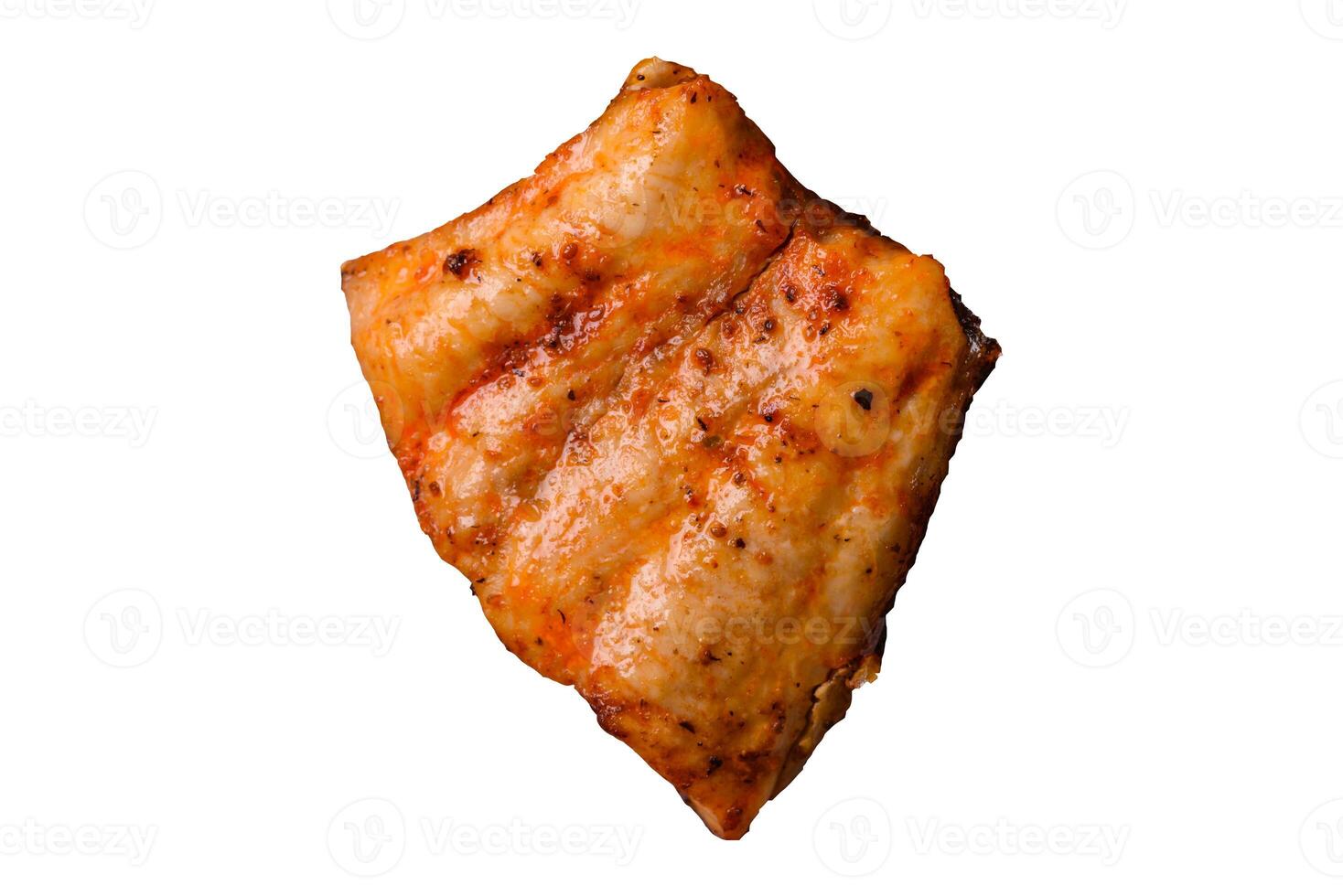 Grilled fish fillet with salt, spices and herbs on a white background photo