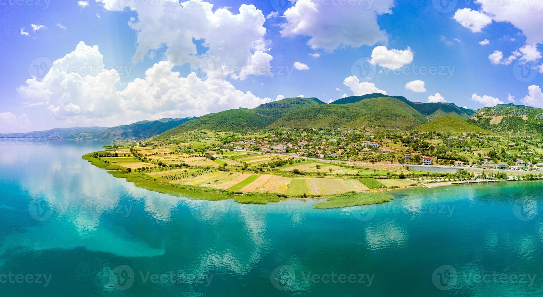 Panorama of fields near Montenegrin villages on the coast of the Adriatic Sea against the backdrop of the Balkan Mountains and sky photo