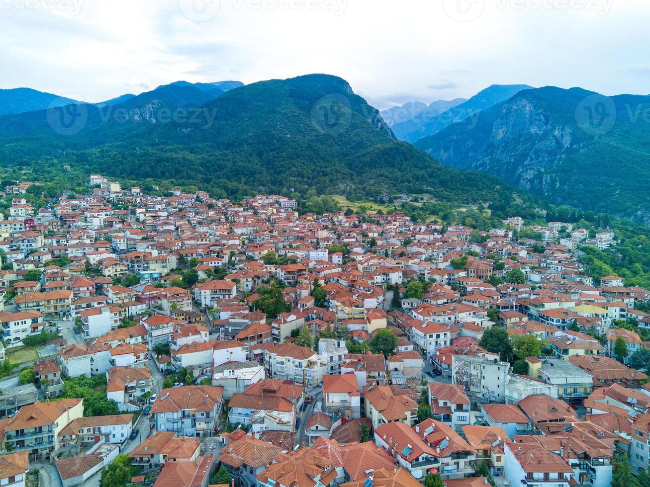 Greek town of Litochoro with small houses against the backdrop o photo