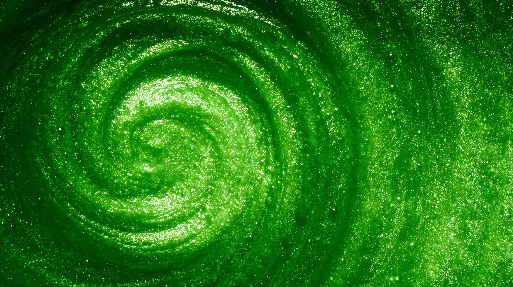 Swirling Emerald Green Glitter Texture with Sparkling Light Particles. photo