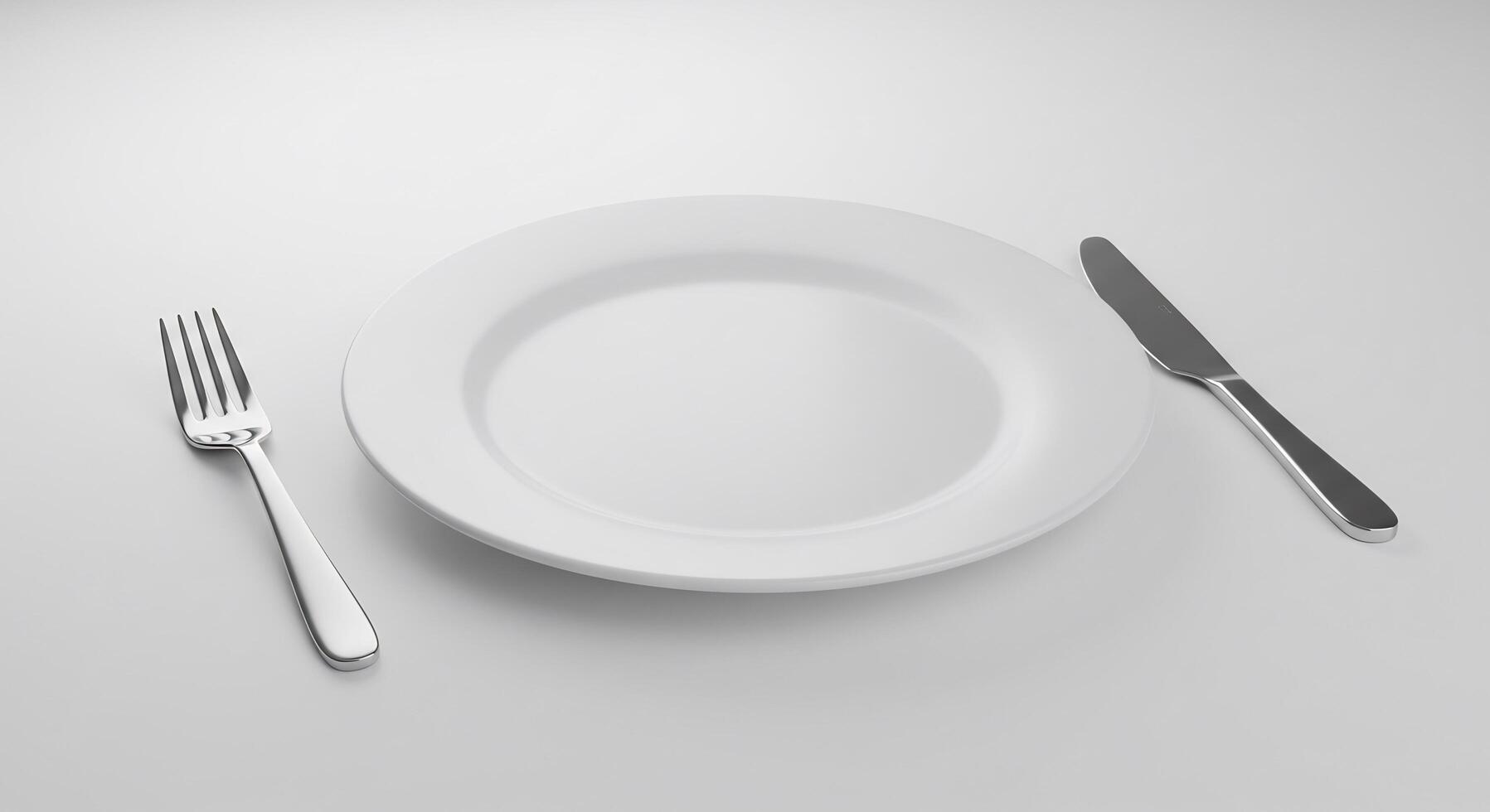 Elegant White Plate With Fork And Knife Rests Neatly On A Table photo