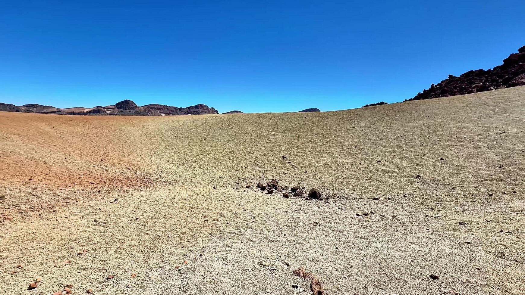 The Breathtaking Stunning Landscape Exhibiting Colorful Earth Formations Beneath a Clear Blue Sky photo