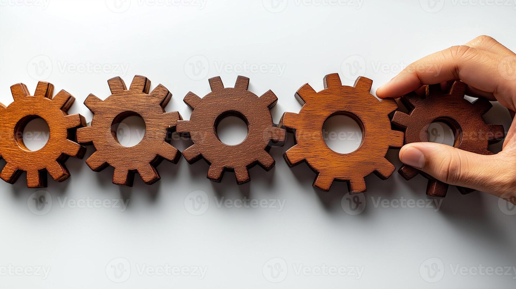 Person hand arranges wooden cogwheels top view, image closeup. Importance of connection between team members close-up photography. Business collaboration concept photo realistic