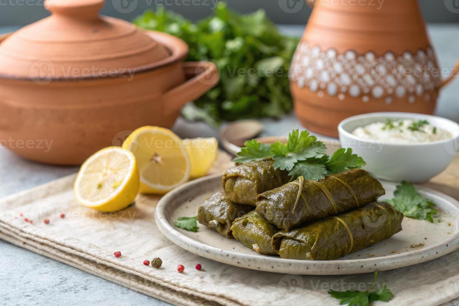 Stuffed grape leaves with lemon slices photo