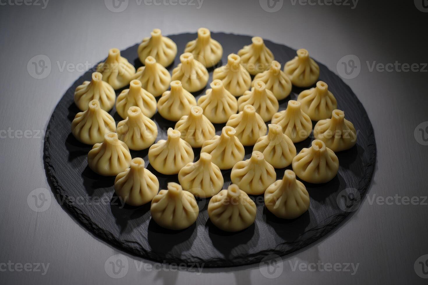 A platter of delicious, traditional Georgian khinkali dumplings, ready to eat. photo