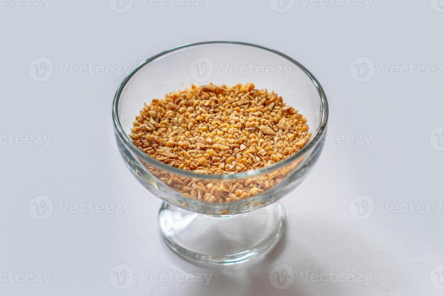Chopped walnuts in a glass bowl, a delicious ingredient in Georgian cuisine. photo