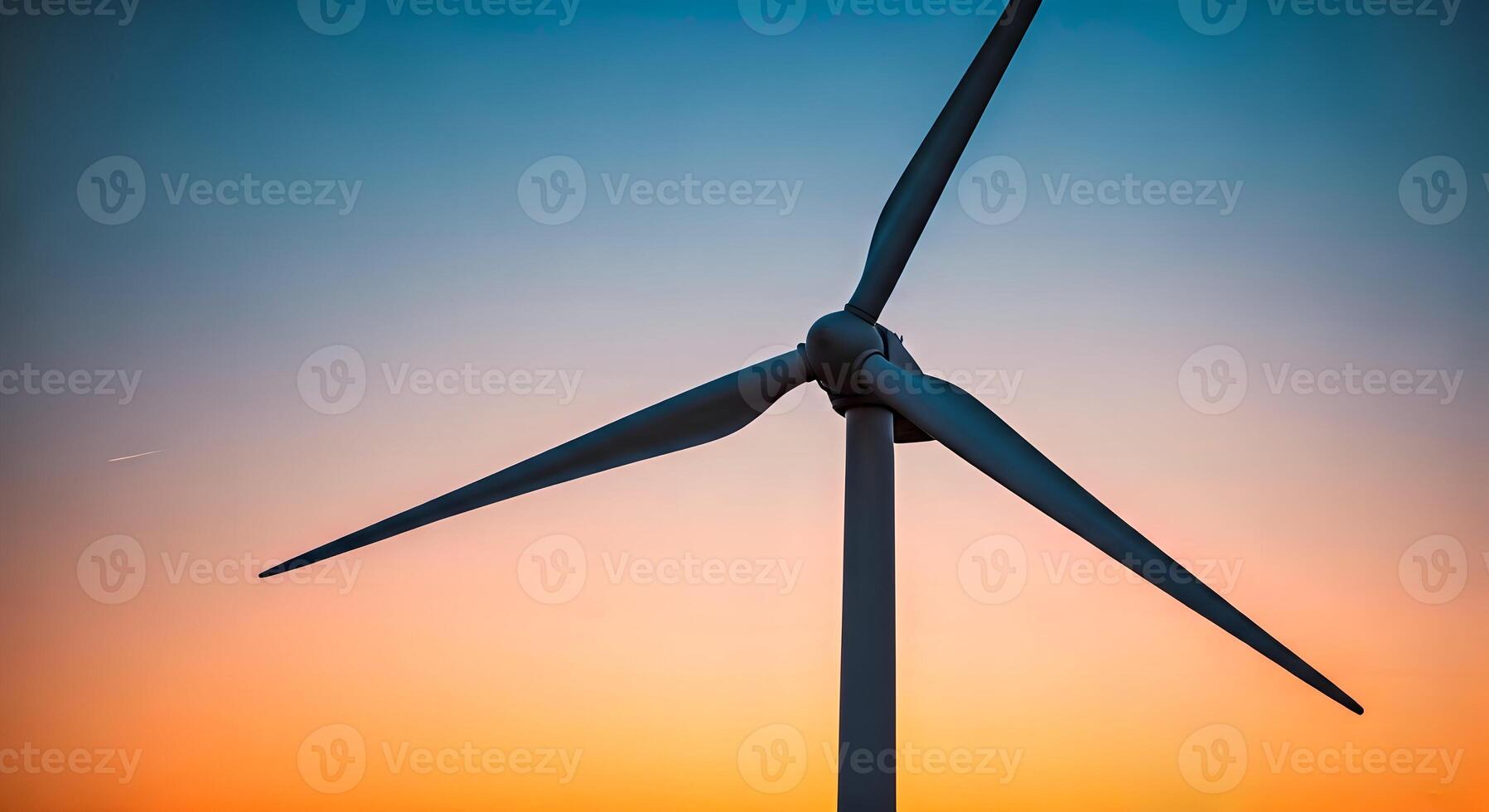 Wind turbine at sunset photo