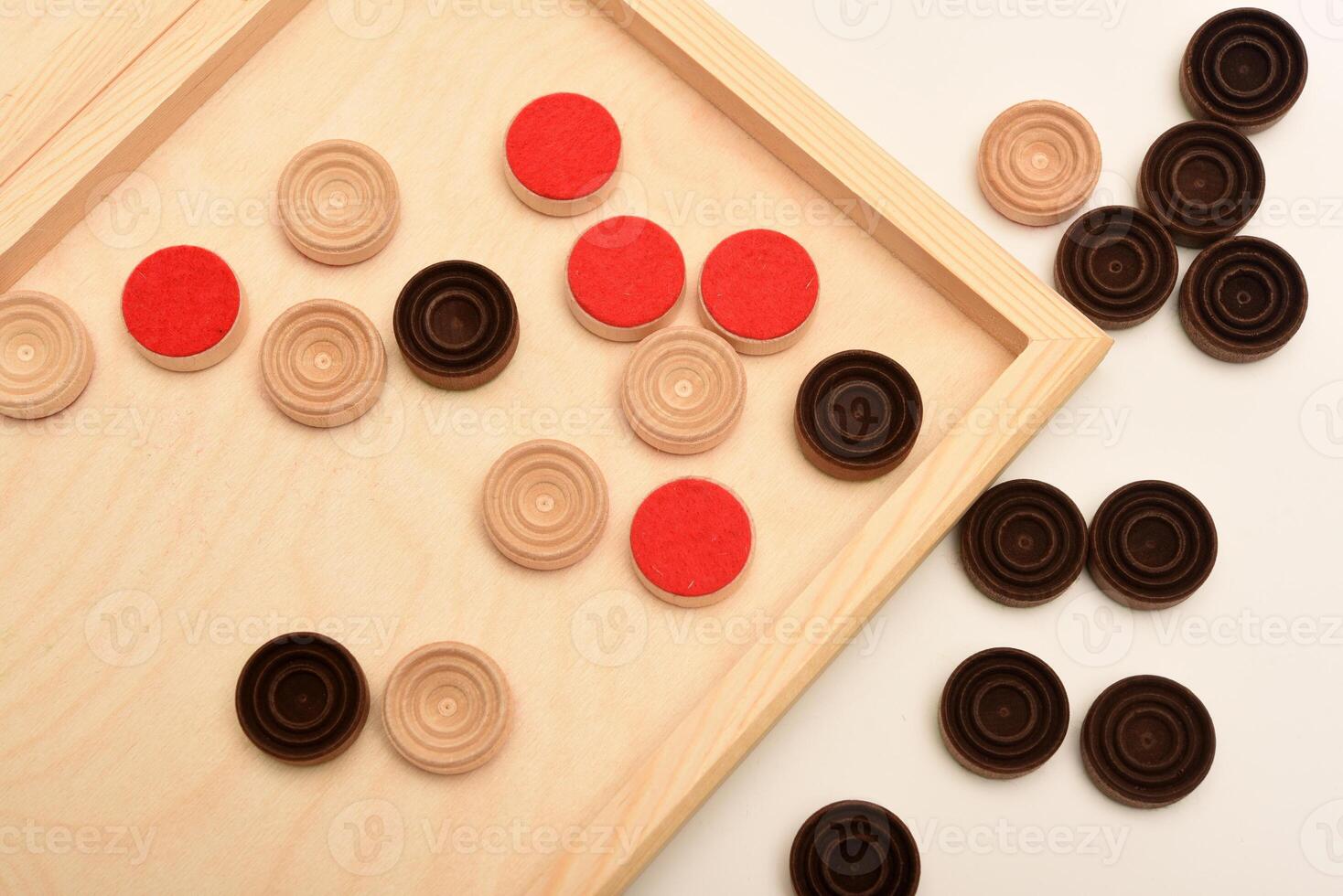 Classic checkers game setup.. Wooden checkers on the board. The board game checkers. photo