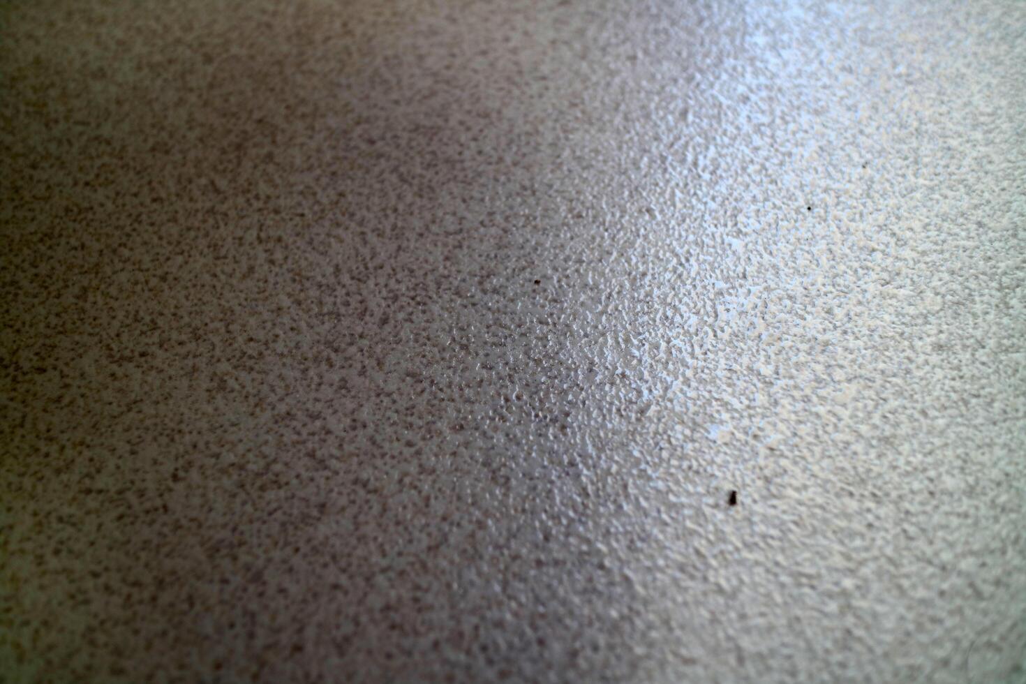 Textured Beige Surface with Subtle Sheen photo