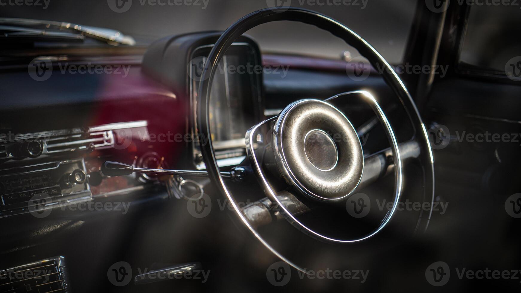 Vintage Classic car steering wheel, with chrome and leather textures in sharp detail, showcases the quality and precision of automotive craftsmanship under natural light.bt photo