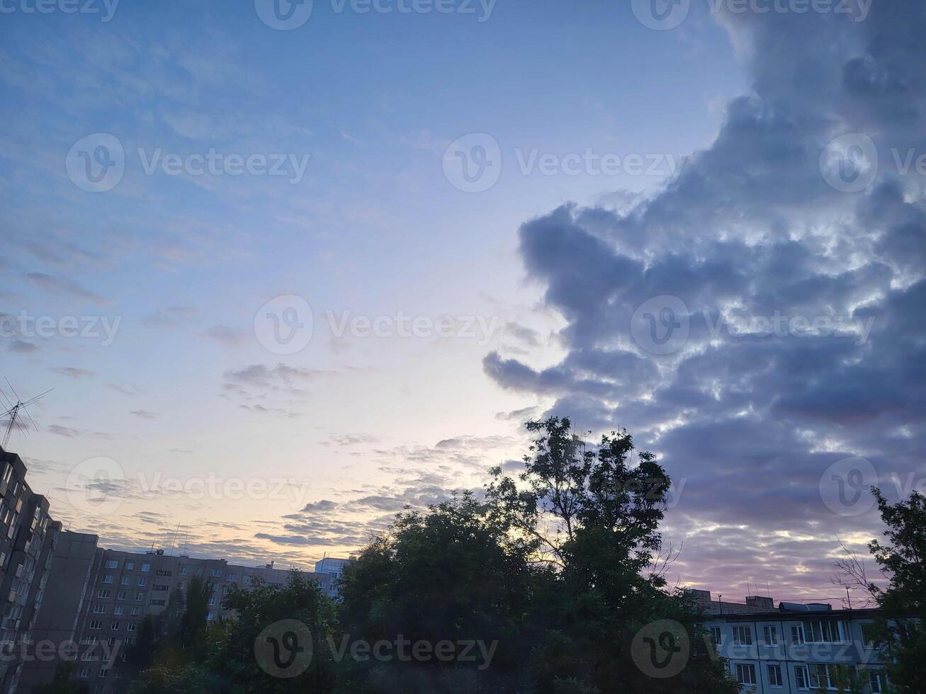 Strange evening storm clouds over the city photo