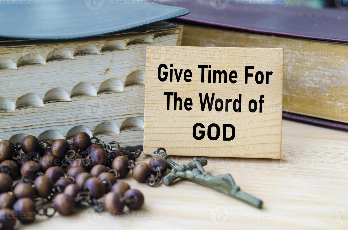 Give Time For The Word of God text on wooden block with Holy Bible and Holy Rosary background. Christianity concept photo