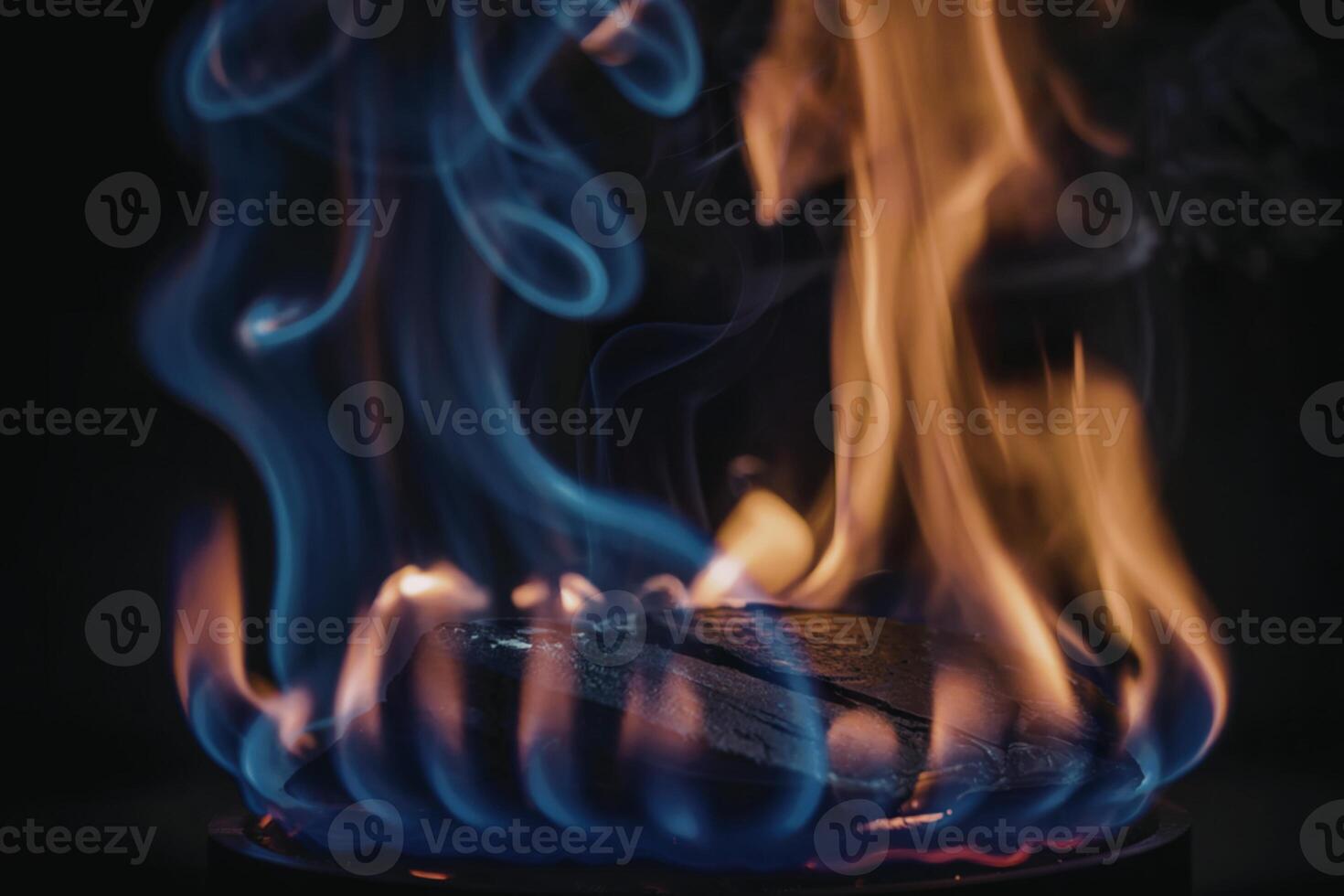 A photograph capturing the dramatic contrast between two distinct flames photo